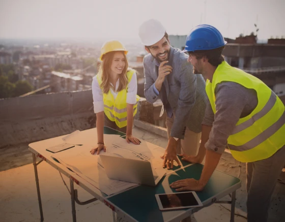 A group of construction workers having a laugh between work.